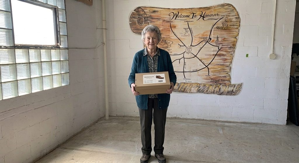 Lady carrying a box of shoes mockup